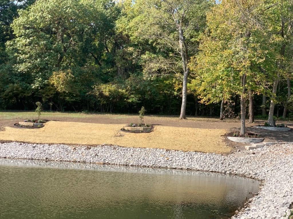 Lakeside hardscape with stone garden beds