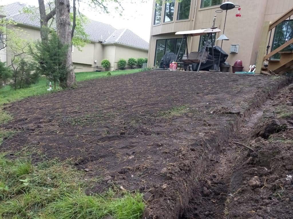 Bare tilled soil in backyard ready for seeding